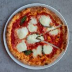 A margherita pizza on a plate